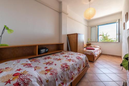 Postel nebo postele na pokoji v ubytování Casa Vacanze 21 Aprile - T