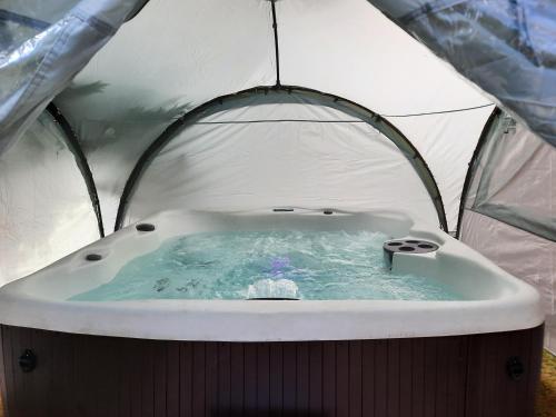 a hot tub inside of a tent at Fir Tree Cottage in Blairgowrie