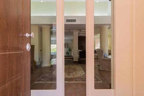 a door to a room with a living room at Villa Caterina in La Maddalena