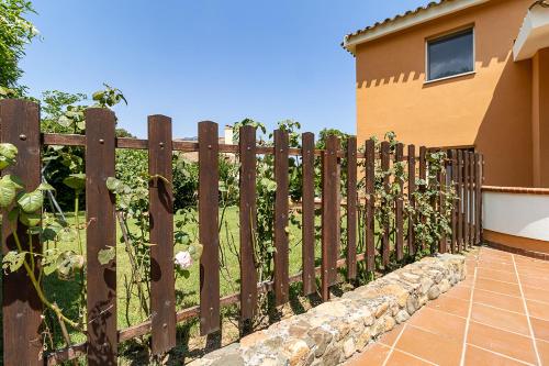 a wooden fence in front of a house at Villa Caterina in La Maddalena