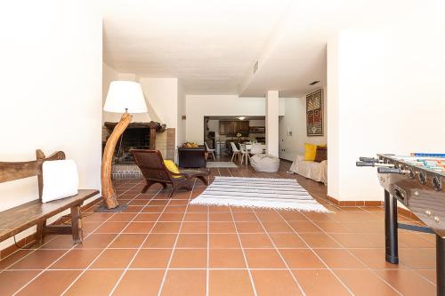 a living room with a couch and a table at Villa Caterina in La Maddalena