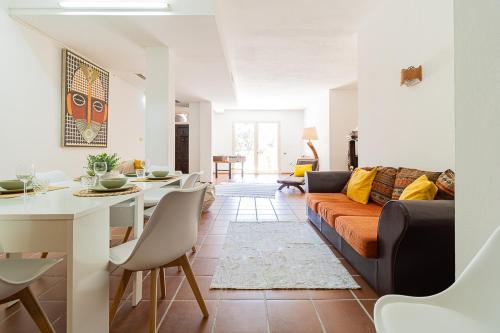 a living room with a couch and a table at Villa Caterina in La Maddalena