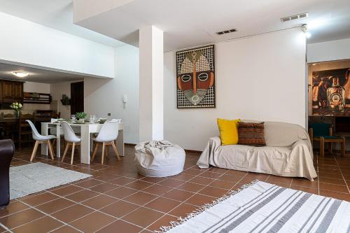 a living room with a couch and a table at Villa Caterina in La Maddalena