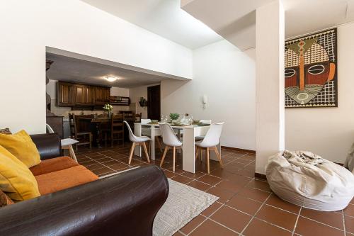 a living room with a couch and a table at Villa Caterina in La Maddalena