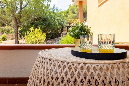 two glasses of beer sitting on a table at Villa Caterina in La Maddalena