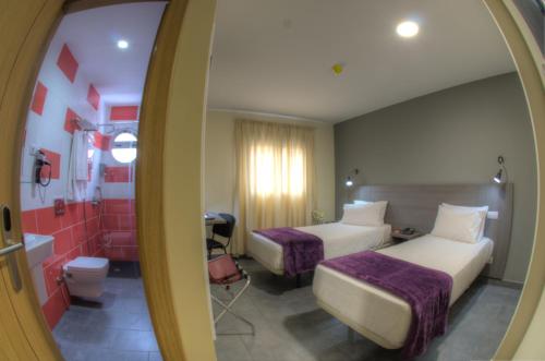Katil atau katil-katil dalam bilik di Hotel Puerto Canteras