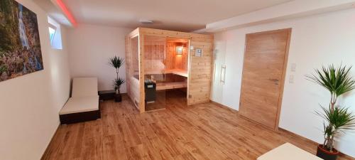 a room with a closet and a room with a desk at Ferienwohnung Hipp - Bockstallsee in Halblech