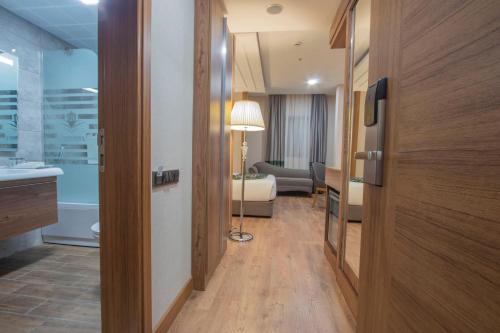 a hallway of a hotel room with a door and a living room at UNITED HOTEL INTERNATIONAL in Yaoundé