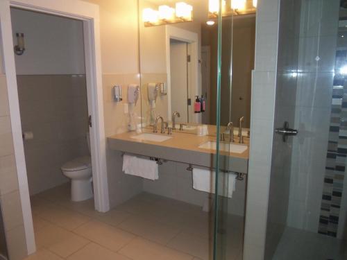a bathroom with a sink and a toilet and a shower at Century Casino & Hotel Cripple Creek in Cripple Creek