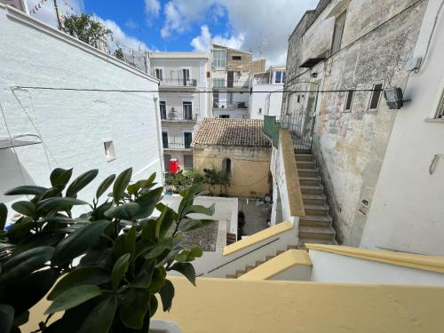 a view from the balcony of a building with stairs at B&B Le Volte 27 in Gravina in Puglia