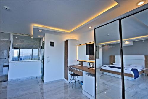 a bedroom with a bed and a desk in it at Stonehillkaş in Kas