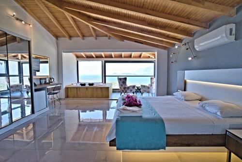 a bedroom with a bed and a view of the ocean at Stonehillkaş in Kas