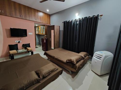 Ένα ή περισσότερα κρεβάτια σε δωμάτιο στο Suvarna Farm Stay