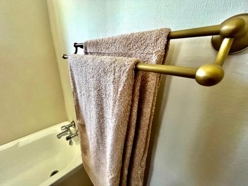 a towel hanging on a towel rack in a bathroom at MILIMA Big 5 Safari Lodge in Hoedspruit