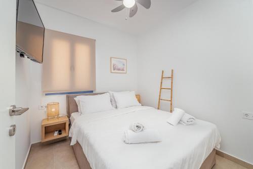 Postel nebo postele na pokoji v ubytování Greek Beach House Complex A4