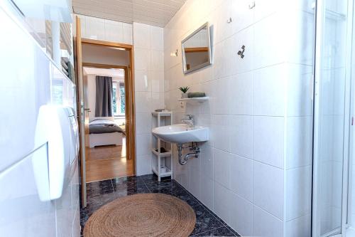 a bathroom with a sink and a shower at Modern Apartment in Lüdenscheid in Lüdenscheid