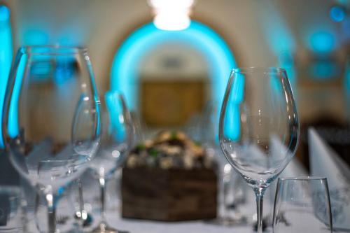 a group of wine glasses sitting on a table at Takler Kúria in Szekszárd