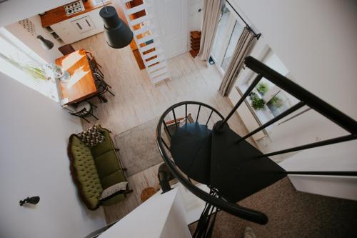 an overhead view of a chair and an umbrella at Domek przy winnicy in Kolonia Depułtycze Królewskie