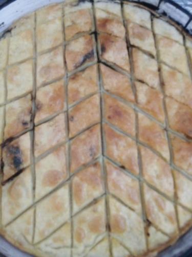 a close up of a pie in a pan at Guest House Stevovski in Ohrid