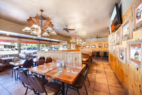 a dining room with tables and chairs in a restaurant at Big Horn Lodge in Moab
