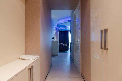 a hallway with a hallway leading to a room at The SPOT apartments - Orbi Beach Tower in Batumi