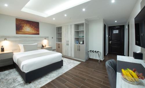 Ein Bett oder Betten in einem Zimmer der Unterkunft Hotel Mokka City