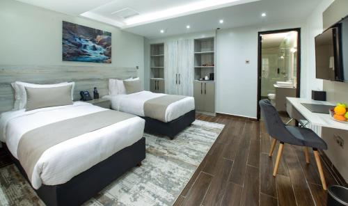 Ein Bett oder Betten in einem Zimmer der Unterkunft Hotel Mokka City