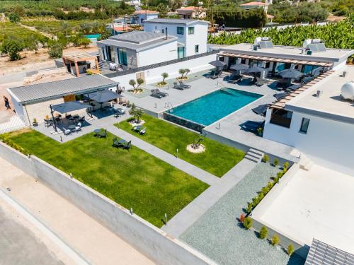an aerial view of a house with a swimming pool at Antesia Coral Bay Resort by Ezoria Villas - Adults only in Coral Bay