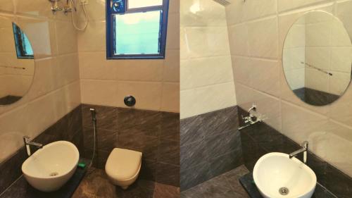 a bathroom with two toilets and a sink at Rajdhani Resort Lonavala in Lonavala