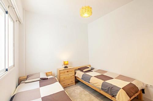 Postel nebo postele na pokoji v ubytování City Loft - Helles und geräumiges Apartment in Santa Cruz