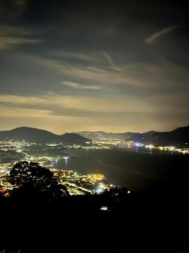 a view of a city at night at Relais I Due Roccoli in Iseo