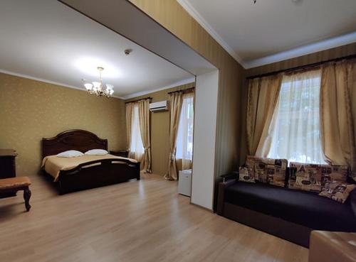 a bedroom with a bed and a large window at Evropeyskiy in Kyiv
