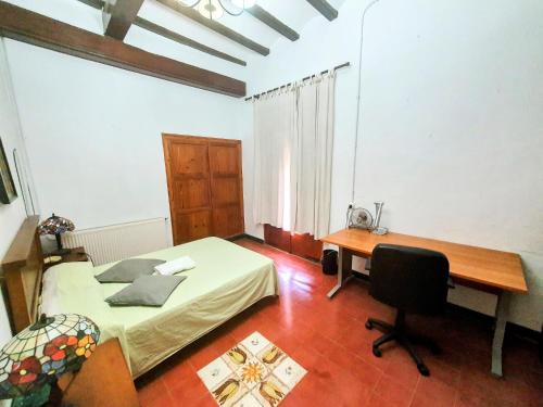 Ein Bett oder Betten in einem Zimmer der Unterkunft CASA BAUTISTA TURIS