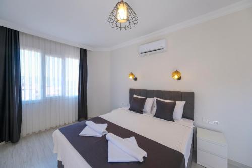 Postel nebo postele na pokoji v ubytování Tatil Premium Cozy Suite