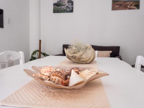a plate of pastries sitting on a table at Affittacamere Solki in SantʼAntìoco