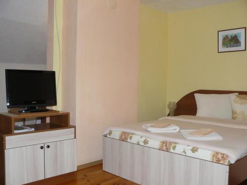 Ένα ή περισσότερα κρεβάτια σε δωμάτιο στο Geto Apartment
