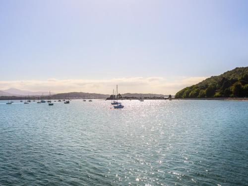 a group of boats in a large body of water at Above Deck in Beaumaris