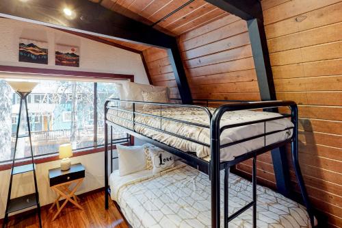 a bunk bed in a room with a window at Chapel Grove in Tahoe City