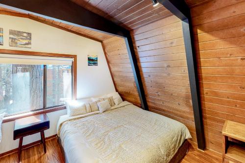 a bedroom with a bed in a room with a window at Chapel Grove in Tahoe City