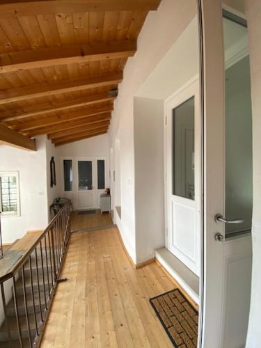 a hallway of a house with a wooden ceiling at River Inn Arco in Arco