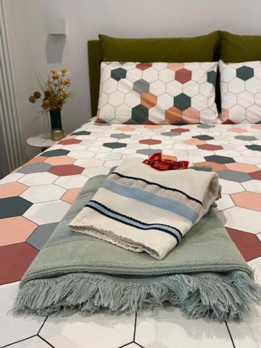 a bed with a pillow on top of it at River Inn Arco in Arco