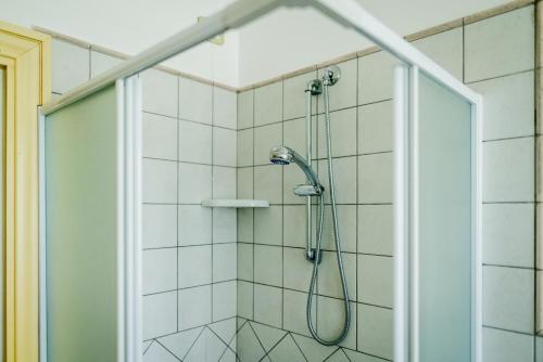 a shower with a shower head in a bathroom at L'Incanto dei Sibillini in Cessapalombo