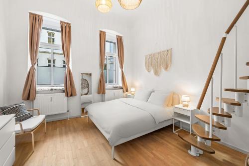 Postel nebo postele na pokoji v ubytování The BoHo Loft VIE