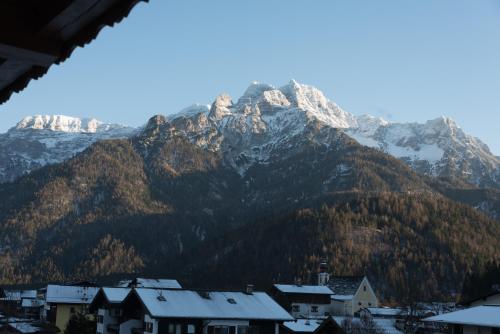 a mountain in the distance with a town and houses at Haus Barbara in Waidring