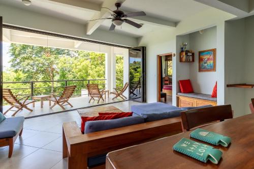 a living room with a couch and a table at Casa Paraíso - 2nd Floor in San Juan del Sur