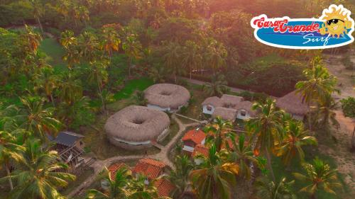 an aerial view of a resort with palm trees at Casa Grande Surf in Guachaca