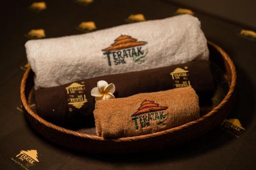 a basket filled with towels and towels at Hotel Penaga in George Town