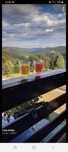 three glasses sitting on top of a window sill at Pensiunea Agroturistica Acvila Apusenilor in Vadu Moţilor