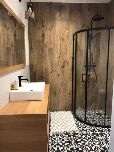 a bathroom with a shower and a sink at Calma House Ublik in Wyszowate