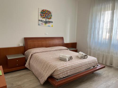a bedroom with a bed with two speakers on it at Maison Merci in Pedemonte
